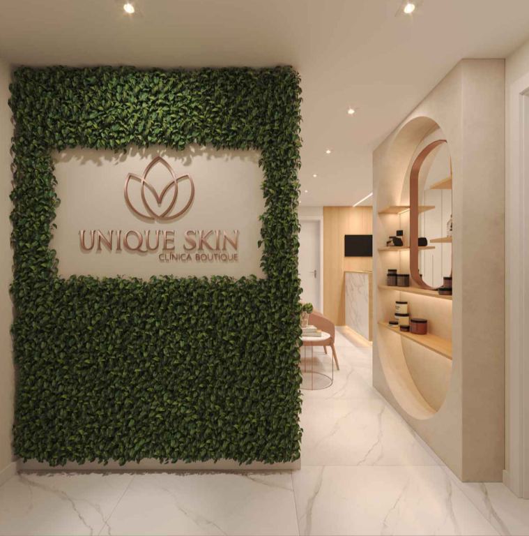 Mural com a logo da Unique Skin Clínica Boutique